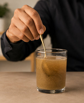 Mix in a glass of lukewarm or normal water, or take it directly with water